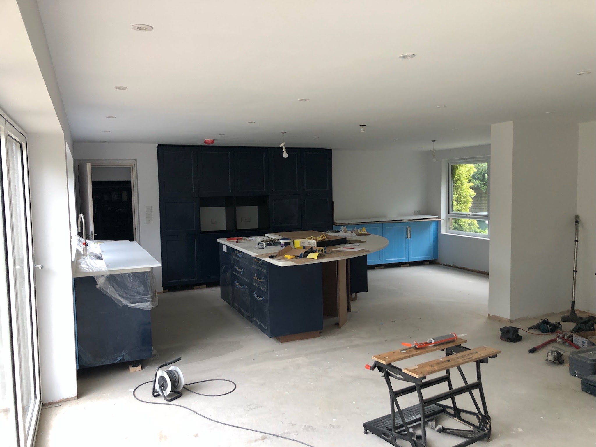 Open-plan kitchen mid-renovation during a full house rewire